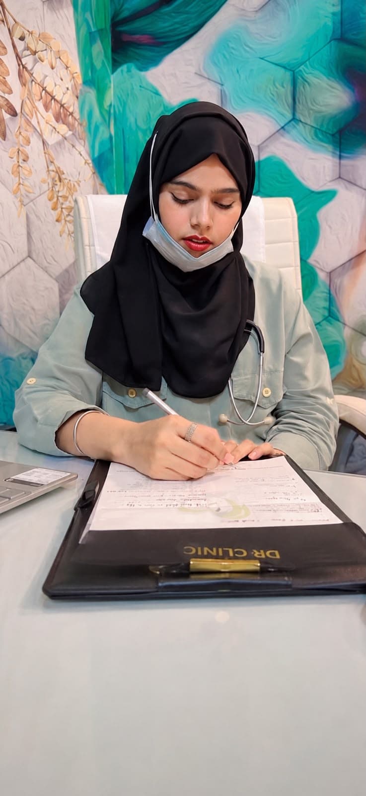 Dr. Sakeena during consultation